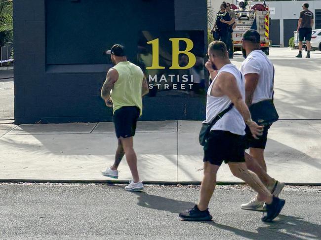 Abdulrahim (yellow tank top) enters the Furlan Club on Thursday after the fire. Picture: Supplied