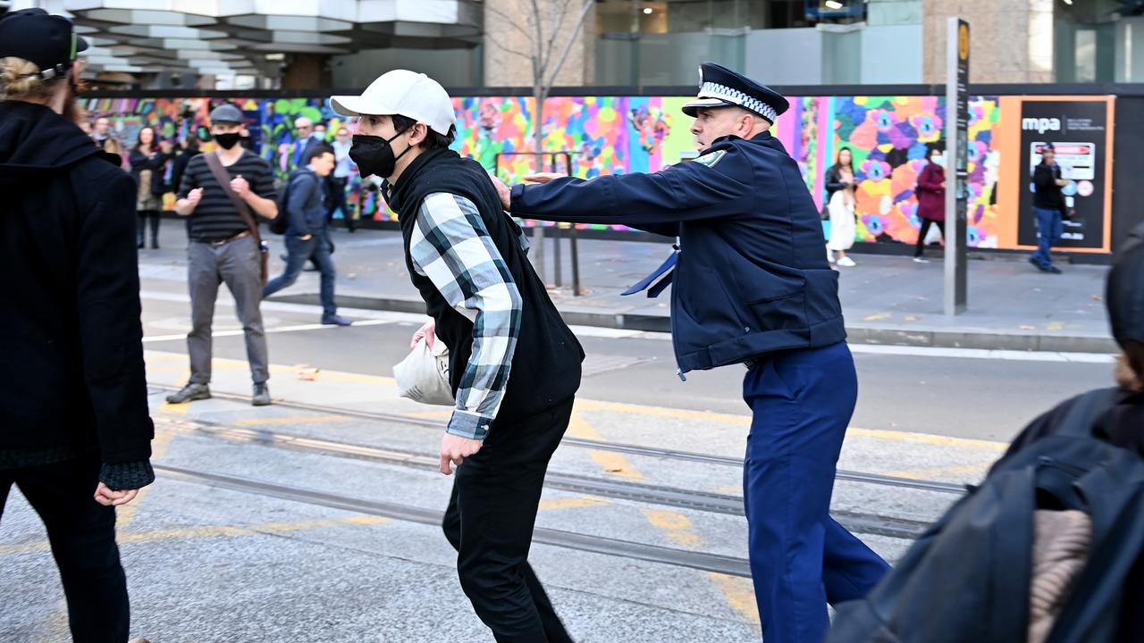 Police try to contain Blockade Australia protesters as they disrupt CBD traffic. Picture: NCA NewsWire / Jeremy Piper