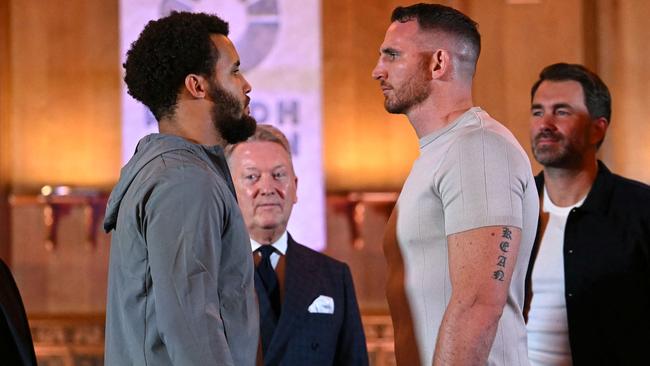 British Slovakian Boxer Moses Itauma (L) and Australian boxer Demsey McKean challenge each other during a press conference, in central London, on October 23, 2024, ahead of their heavyweight undercard fight, taking place on December 21, 2024 in Riyadh, Saudi Arabia. (Photo by JUSTIN TALLIS / AFP)