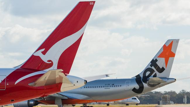 ESCAPE: Jetstar and Qantas aircraf tails. Picture: Jetstar