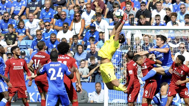 Liverpool's goalkeeper Alisson, center, makes a save during the English Premier League soccer match between Leicester City and Liverpool at the King Power Stadium in Leicester, England, Saturday, Sept. 1, 2018. (AP Photo/Rui Vieira)