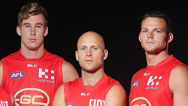 Former captain Gary Ablett with new Gold Coast Suns co-captains Tom Lynch and Steven May.