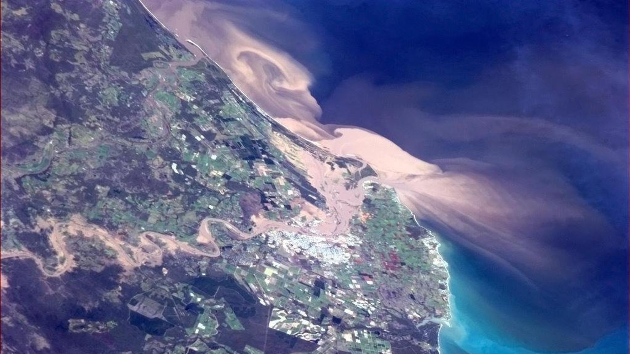 2012-2013 wet season: A photo of Bundaberg and the heavily sediment-laden flood plume moving out into the coast from the mouth of the Burnett River.