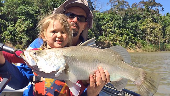 Ben Peel with daughter and young angler Tilly, 4, and one of her seven barra caught down the Daly River.