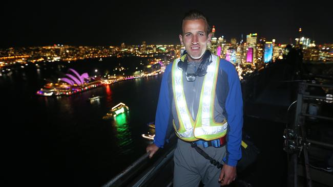 Harry Edward Kane who plays for Tottenham Hotspur. Spurs arrive in Sydney on Thursday and the players will be climbing the Sydney Harbpour Bridge as part of the Vivid festival.