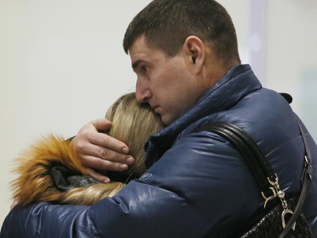 Grief ... Relatives react after a Russian airliner with 217 passengers and seven crew aboard crashed, as people gather at Russian airline Kogalymavia’s information desk at Pulkovo airport in St. Petersburg. Picture: Dmitry Lovetsky/AP Photo