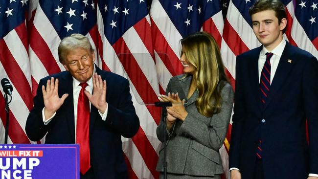 Donald Trump with his wife Melania and their son Barron Trump at the West Palm Beach Convention Centre in Florida. Picture: Getty Images.