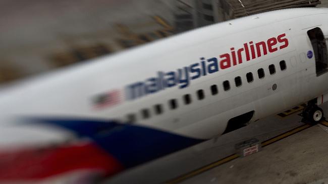 A Malaysia Airlines plane parked on the tarmac at Kuala Lumpur International Airport.