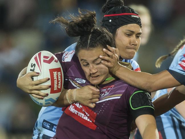 Annette Brander of the Maroons is tackled during the Women's State of Origin match between the NSW Blues and Queensland Maroons at North Sydney Oval in Sydney, Friday, June 22, 2018. (AAP Image/Craig Golding) NO ARCHIVING, EDITORIAL USE ONLY