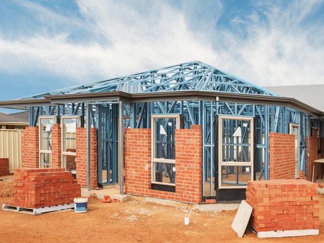 New residential construction home from brick with metal framing against a blue sky; real estate Australian generic suburban homes