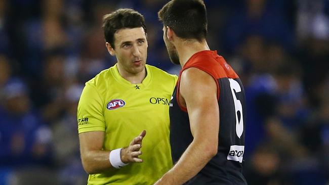 Umpire Jordan Bannister talks with Chris Dawes after a free kick. Picture: Michael Klein