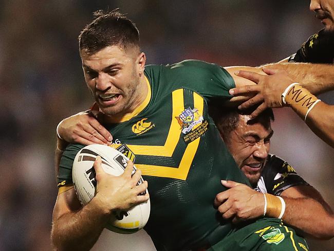WOLLONGONG, AUSTRALIA - OCTOBER 25: James Tedesco of Australia is tackled during the International Rugby League Test Match between the Australian Kangaroos and the New Zealand Kiwis at WIN Stadium on October 25, 2019 in Wollongong, Australia. (Photo by Mark Metcalfe/Getty Images)