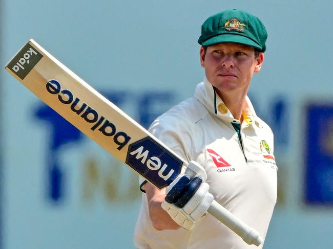 Australia's captain Steve Smith celebrates after scoring a half-century (50 runs) during the second day of second test cricket match between Australia and Sri Lanka at the Galle International Cricket Stadium in Galle on February 7, 2025. (Photo by Ishara S. KODIKARA / AFP)