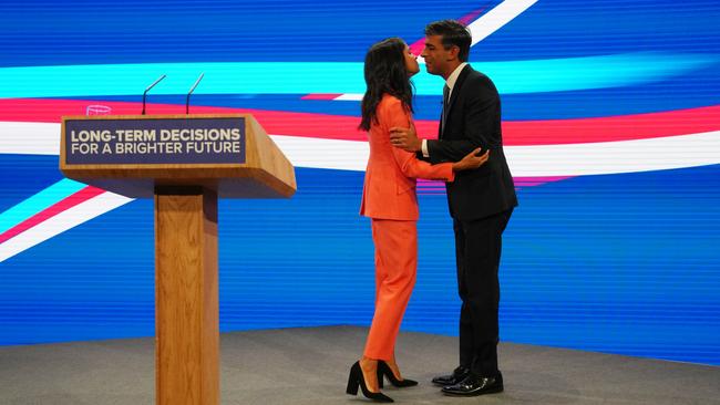 Akshata Murty embraces her husband Prime Minister Rishi Sunak during the final day of the Conservative Party Conference in Manchester, England.