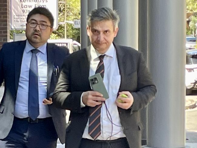 Slobodan Jankovic (right) entering Burwood Local Court.