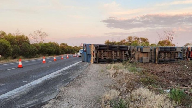 A B-double carrying livestock rolled on a busy highway on Friday after two trucks side swiped each other.