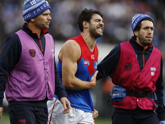 MELBOURNE, AUSTRALIAÃ June 10, 2024.  AFL Round 13. Big Freeze at the G. Collingwood vs Melbourne  at the MCG.   Christian Petracca of the Demons in pain after copping a Darcy Moore knee in the ribs late in the 1st qtr.       . Pic: Michael Klein