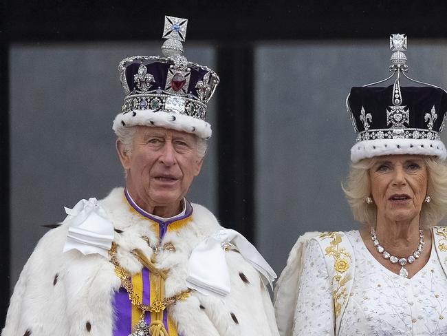 LONDON, ENGLAND - MAY 06: King Charles III and Queen Camilla are seen on the Buckingham Palace balcony during the flypast during the Coronation of King Charles III and Queen Camilla on May 06, 2023 in London, England. The Coronation of Charles III and his wife, Camilla, as King and Queen of the United Kingdom of Great Britain and Northern Ireland, and the other Commonwealth realms takes place at Westminster Abbey today. Charles acceded to the throne on 8 September 2022, upon the death of his mother, Elizabeth II. (Photo by Christopher Furlong/Getty Images)