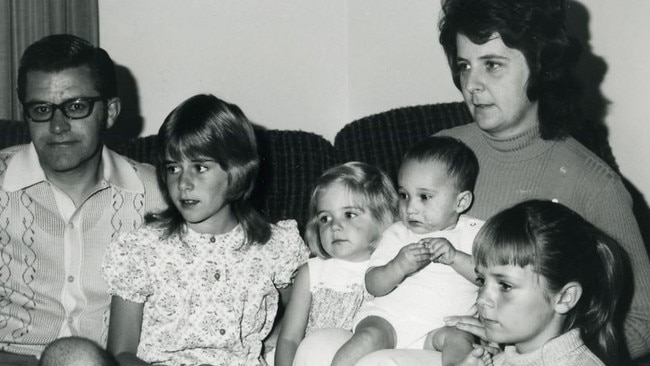Kim Catford as a baby with his adopted family after arriving in Adelaide. Picture: Supplied