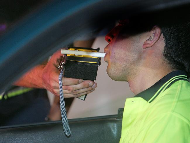 A motorist is breath-tested.