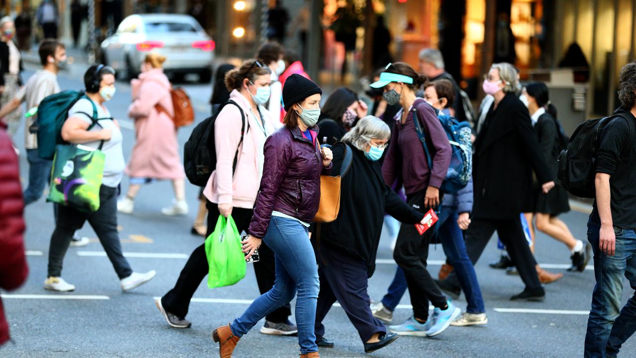 Brisbane citizens wearing masks while out and about in the CBD on Thursday. Picture: David Clark