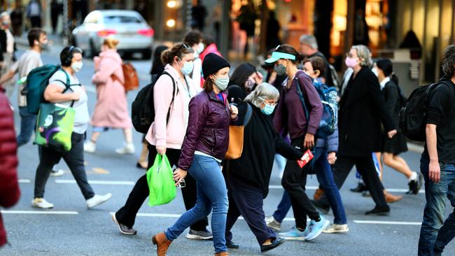 Brisbane citizens wearing masks while out and about in the CBD on Thursday. Picture: David Clark