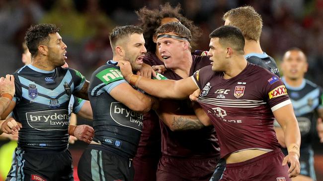 Tim Glasby gets in the middle of an Origin altercation.