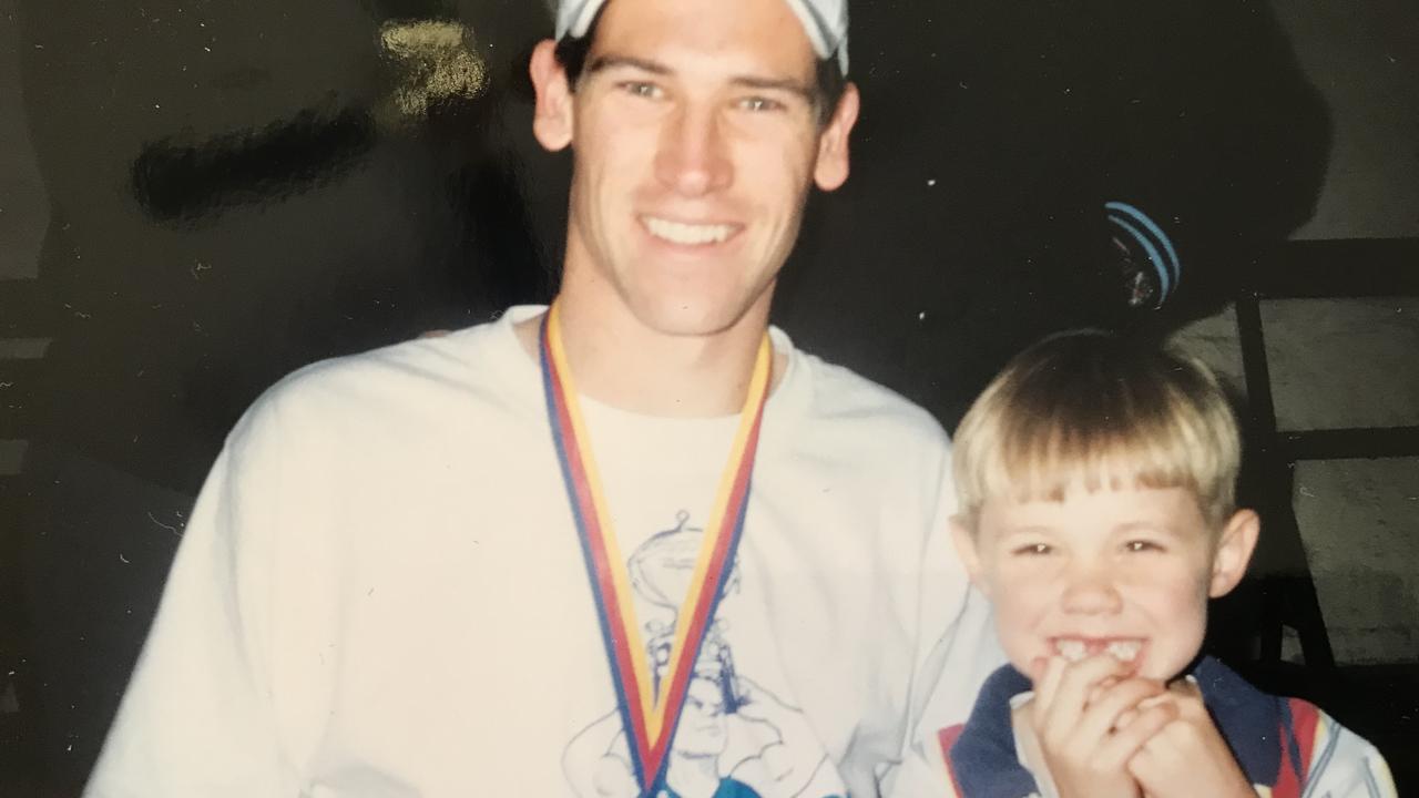 Charlie Parker, aged four, with Sturt’s Martin Mattner, following the Double Blues 2002 SANFL grand final triumph. Picture: Supplied