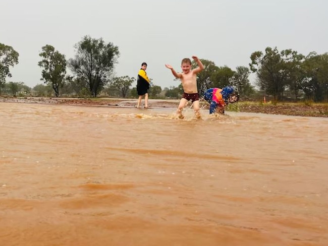 Country kids playing in the mud at Lesdale, Charleville. Picture: Bec Tickell