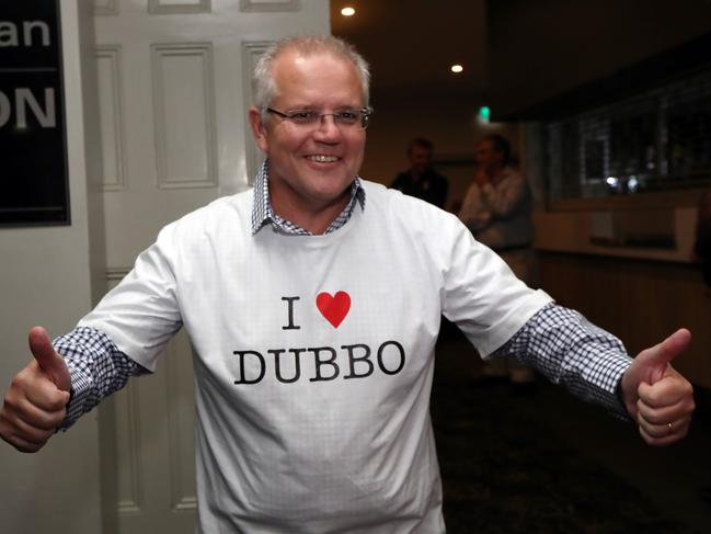 Prime Minister Scott Morrison on the election campaign in Dubbo. The local Mayor Ben Shields with Mark Coulton in the Commercial Hotel in Duibbo gave the Prime Minister a "I Love Dubbo" T-shirt. Picture Gary Ramage