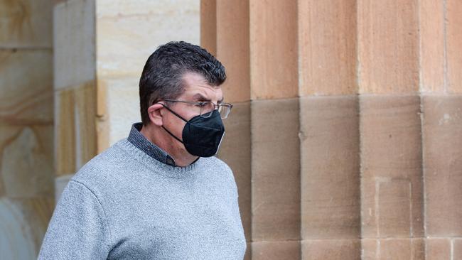 Michael Figwer, former UniSA lecturer and senior member of Rugby SA, leaves the Adelaide Magistrates Court. Picture: NCA NewsWire / Brenton Edwards