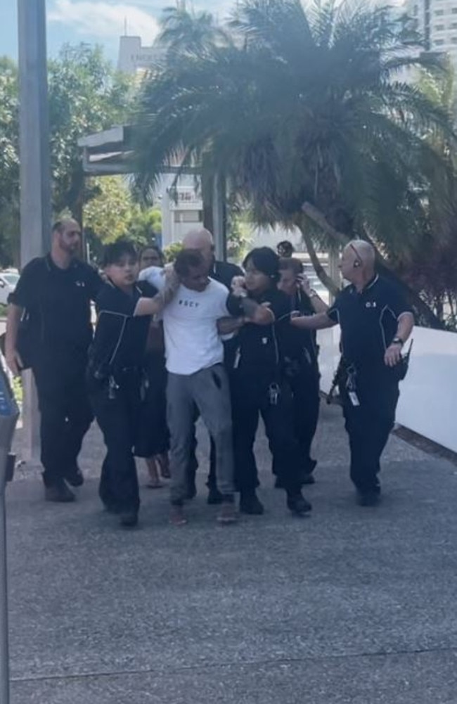 Ezra Austral was restrained by security after evading G4S court security, jumping over the barrier and running down the street at Darwin Local Court on Thursday, May 29. Picture: Zizi Averill
