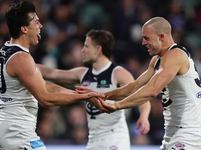 ADELAIDE, AUSTRALIA - MAY 30: Alex Cincotta of the Blues celebrates a goal with Elijah Hollands during the 2024 AFL Round 12 match between the Port Adelaide Power and the Carlton Blues at Adelaide Oval on May 30, 2024 in Adelaide, Australia. (Photo by Sarah Reed/AFL Photos via Getty Images)