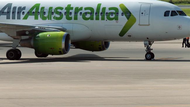 A grounded Air Australia plane sits unattended on the tarmac of the Brisbane International airport in Brisbane on February 17, 2012. AFP PHOTO / Tertius PICKARD