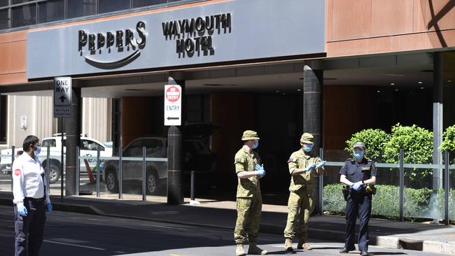 Military personnel stand guard at Peppers Hotel in the CBD where the Parafield cluster originated. Picture: NCA NewsWire / Naomi Jellicoe