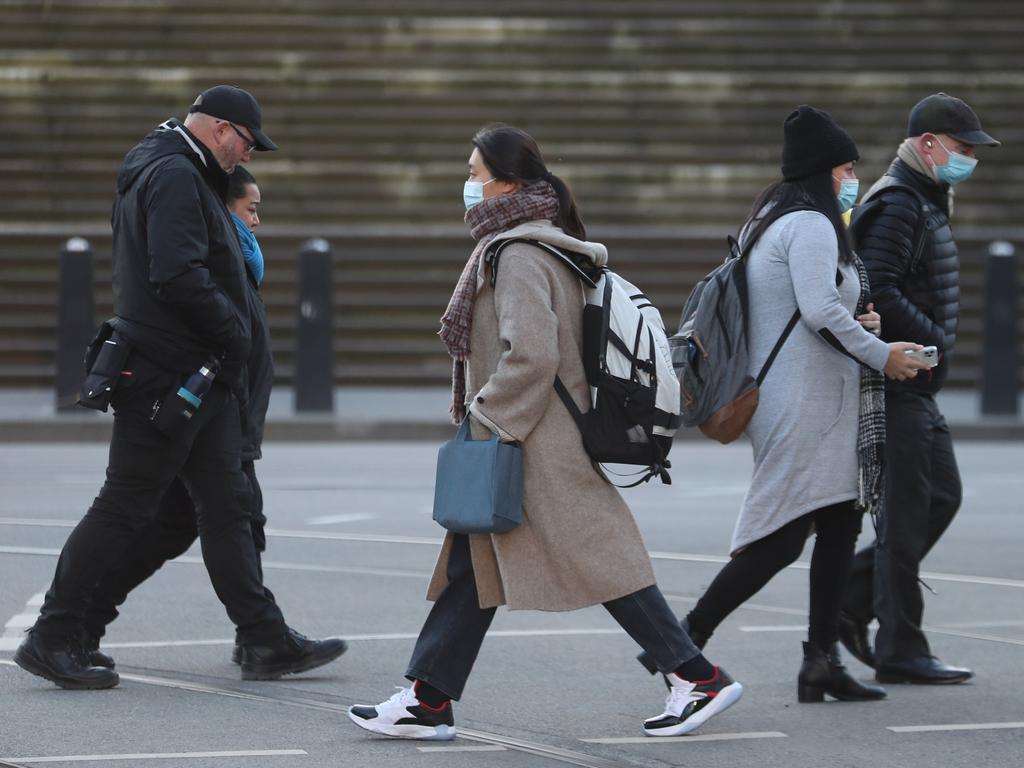 People walking in Melbourne on the coldest day of the year. Picture: NCA NewsWire / David Crosling