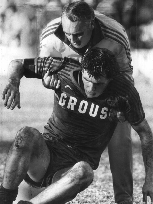 Peter Wynn is helped to his feet after being tackled in a game against Cronulla in the 1979 season.