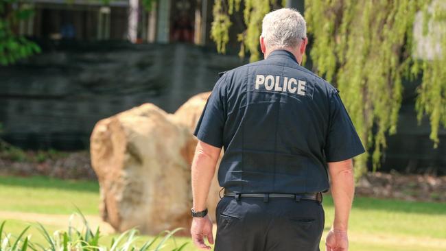 NT Police Commissioner Jamie Chalker walks away after speaking to media at the Peter Macaulay Centre in Darwin. Picture: Glenn Campbell