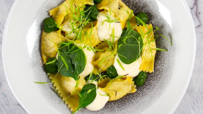 Mushroom agnoloti, parmesan sauce and warrigal greens.