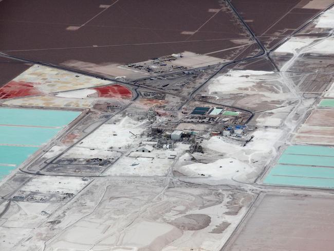 Demand for lithium has skyrocketed with the rise of lithium-ion batteries, putting it at the center of a global scramble. Shown, an aerial view of the brine pools and processing plant at the SQM lithium mine on the Chile’s Atacama salt flat in 2013. PHOTO: IVAN ALVARADO/REUTERS