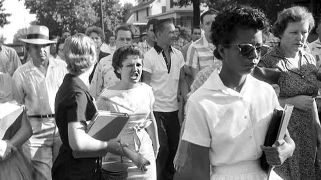 Elizabeth Eckford is jeered by white protesters as she attends Little Rock Central High School, Arkansas, on September 25, 1957.