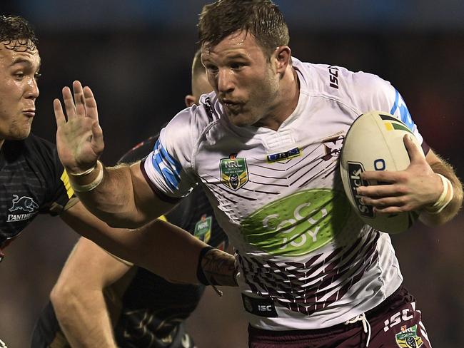 SYDNEY, AUSTRALIA - SEPTEMBER 04: Blake Leary of Manly is tackled during the round 26 NRL match between the Penrith Panthers and the Manly Sea Eagles at Pepper Stadium on September 4, 2016 in Sydney, Australia. (Photo by Brett Hemmings/Getty Images)