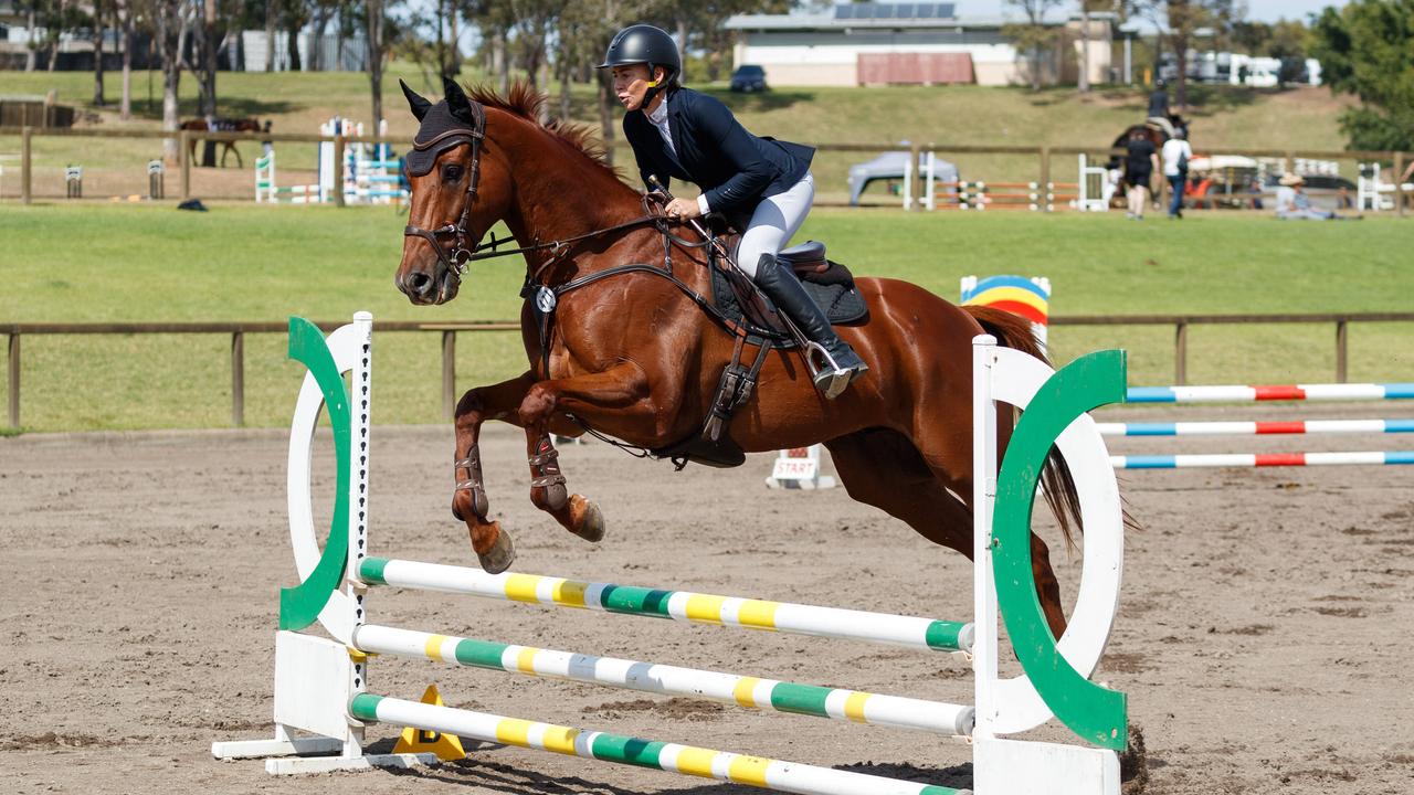 Former jockey Kathy O’Hara and retired racehorse Nature Strip compete in the New Star Thoroughbred Showjumping Class of the Equimillion 2024. Picture: Max Mason-Hubers