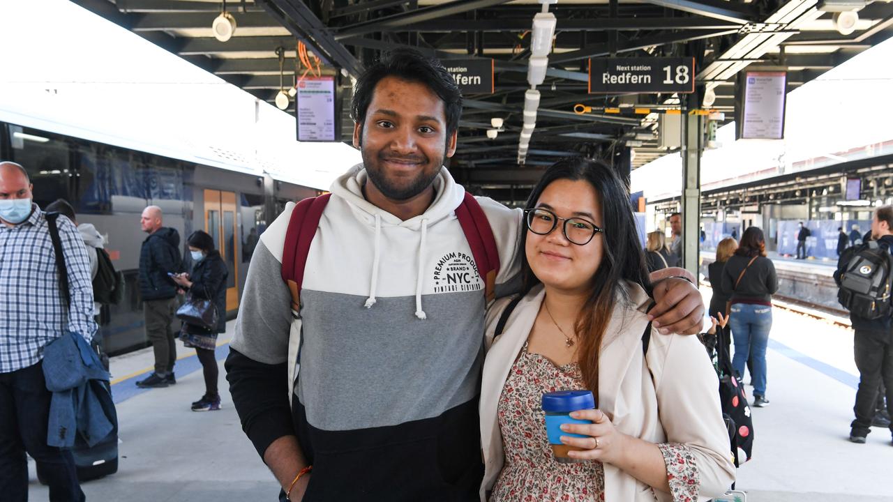 Nikhil Nair and Katai Keoduangdy wait for their train at Central Station on Tuesday morning