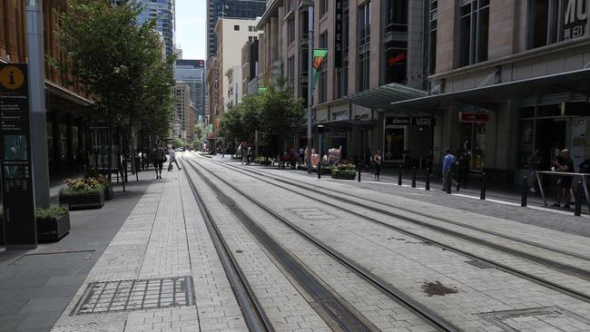 An eerily quiet George St on Friday afternoon. Picture: John Grainger