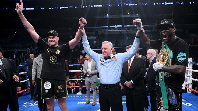 Tyson Fury and Deontay Wilder after their first fight was declared a draw