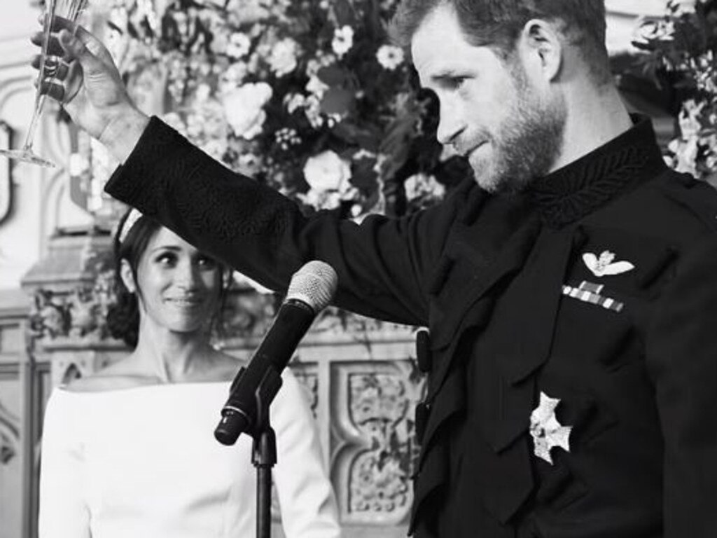 Prince Harry raises a toast at his wedding to Meghan Markle as the Duchess of Sussex watches on. Picture: Netflix