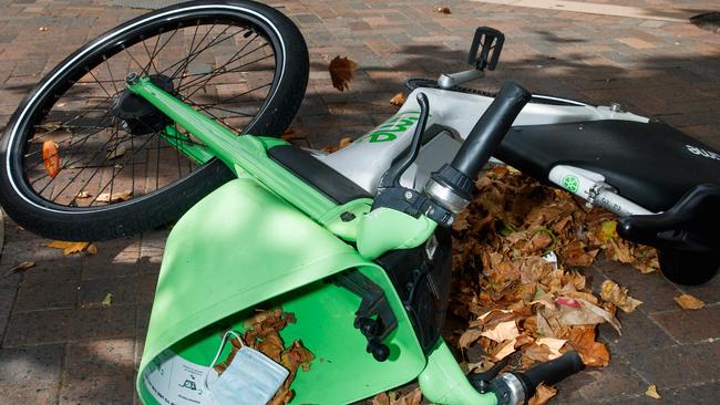 DAILY TELEGRAPH. An e-bike from bike & scooter share company Lime, tipped over on the sidewalk at Martin Place, Sydney. 05/02/2024. Picture by Max Mason-Hubers