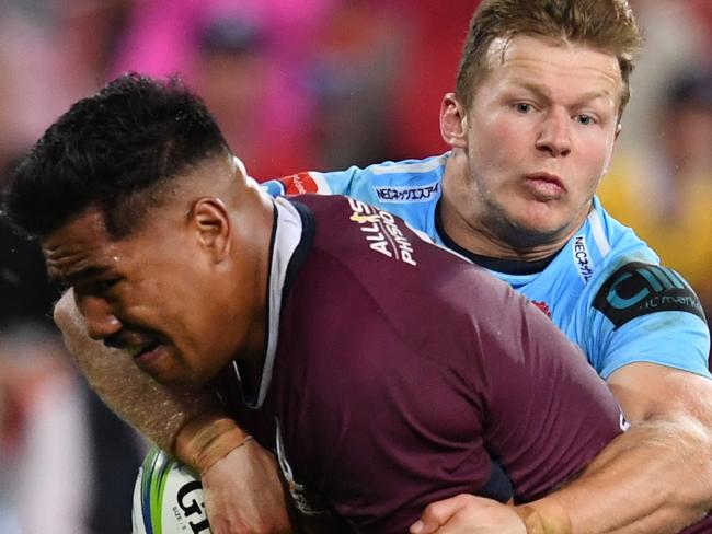 Cameron Clark of the Waratahs (right) tackles Alex Mafi of the Reds during the Round 14 Super Rugby match between the Queensland Reds and the NSW Waratahs at Suncorp Stadium in Brisbane, Saturday, May 18, 2019. (AAP Image/Dan Peled) NO ARCHIVING, EDITORIAL USE ONLY