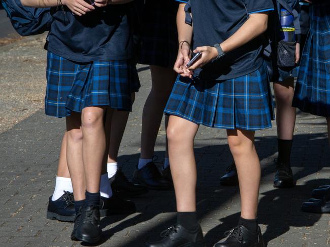 ADELAIDE, AUSTRALIA - NewsWire Photos JANUARY 30, 2023: Non-identifying images of school children entering an Adelaide High School on the first day of the 2023 School year. South Australia is bringing in a controversial new smart phone and smart watch ban for students. Picture NCA NewsWire / Emma Brasier